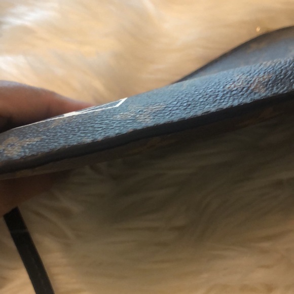 LV wristlet from World Tour collection. Authentic